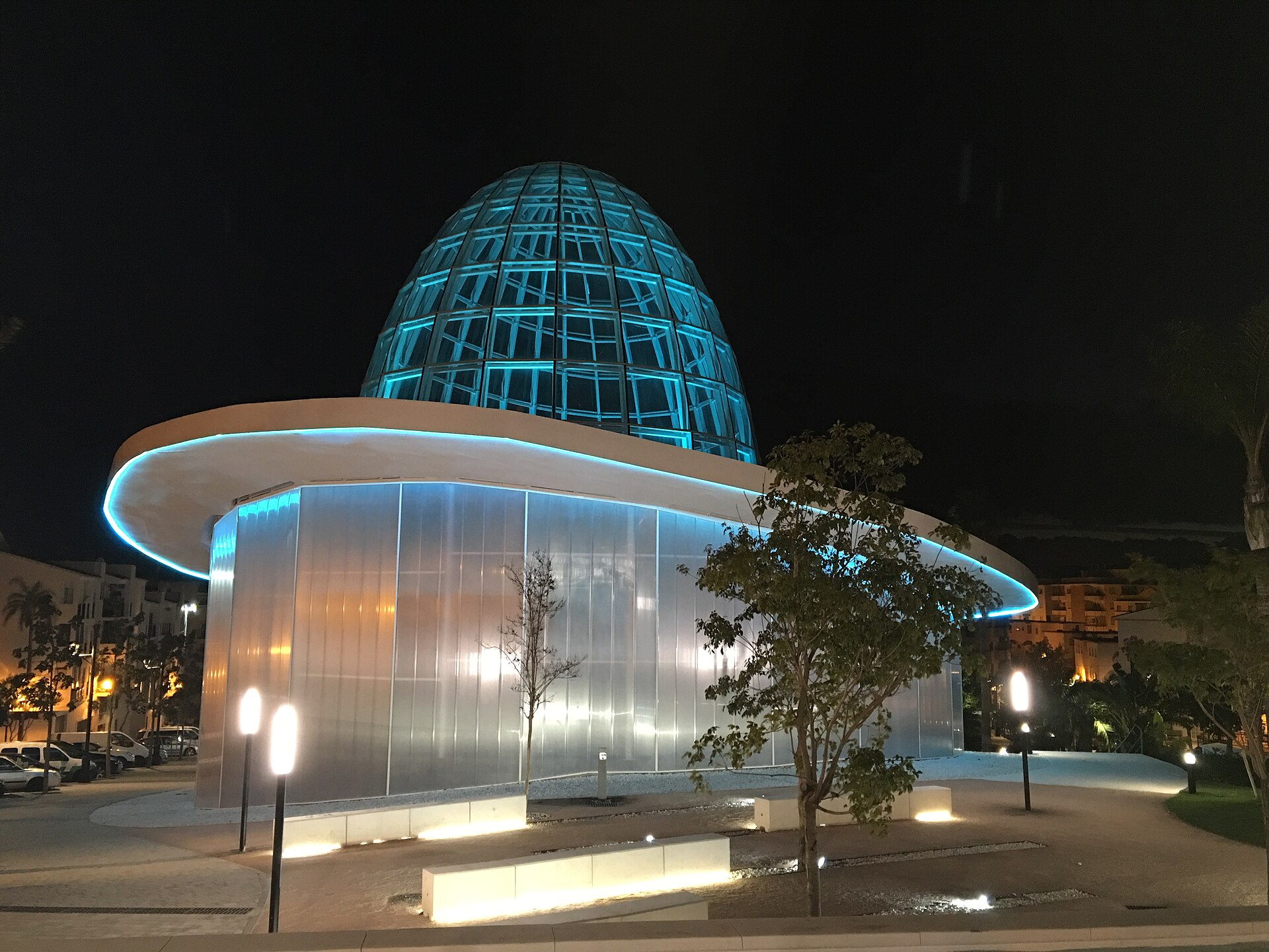 Glass dome of the Orchidarium in Estepona lit up at night