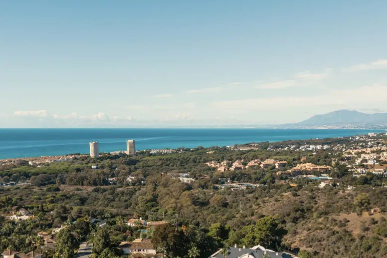 Marbella East from the hills: the coast at Las Chapas and Elviria with the Mediterranean behind